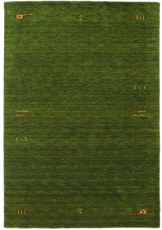 a green area rug with red and blue dots on the bottom, and an orange dot in the middle