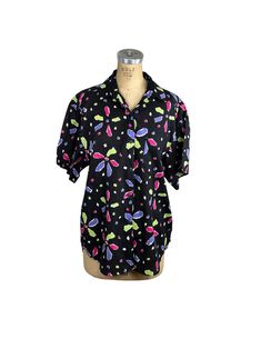 "Fantastic 1980s Esprit Sport collection Blouse in a fun abstract flower and confetti print!  The lime green, purple and pink flowers are scattered on a black background which really makes them \"POP\". It closes with small back buttons. There is a chest pocket on the left side. The size is marked M but it's an 80s oversized style shirt so it can definitely fit a L. The fabric is cotton or a blend but feels like all cotton. There is no fabric content tag.  Made in Hong Kong. Excellent condition. Black Tops With Colorful Pattern For Summer, Black Top With Colorful Summer Pattern, Black Top With Colorful Pattern For Summer, Casual Black Tops With Colorful Pattern, Black Tops With Abstract Print For Spring, Black Shirt With Abstract Print For Spring, Retro Black Shirt For Spring, Black Retro Summer Blouse, Black Summer Blouse With Abstract Print