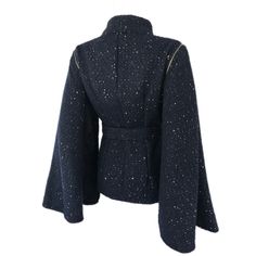 * Amazing design that can be worn 2 ways * Fitted Jacket with detachable cape style sleeves - can be worn as sleeveless jacket/vest * Beautiful black and navy woven boucle fabric with pewter colored sequins * Gold zipper details on sleeves * Fully lined * Button closure on front * Matching Waist belt with button closure Available Sizes: * Sizes: XS- XL * Sleeve Length: 25 inches * Buttons MAY vary due to availability *** Please allow up to 1 week for item to be completed. *** Black Wool Party Outerwear, Luxury Cape For Fall, Luxury Wool Outerwear For Party, Avant-garde Winter Evening Outerwear, Fitted Cape For Workwear, Fitted Cape Outerwear For Work, Chic Fitted Cape Outerwear, Chic Evening Cape Outerwear, Fitted Outerwear With Stand Collar For Evening