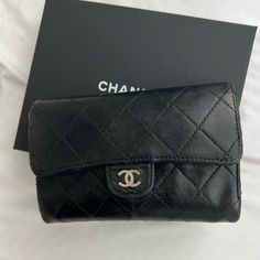 (Final Clearance Items Require Shipping From The Realreal And Estimated 2 Weeks Delivery Time. Oftentimes, It’s Faster.) Last Picture Is This Actual Exact Item Listed On The Realreal. It Is Listed For $995. Beautiful Black Chanel Diamond Quilted Lambskin Leather Gusset Woc Worn 3 Ways- Crossbody, Shoulder, Clutch Wallet. Approx 6x4x2” Has A Pocket In Back, Pocket In The Front, 2 Compartments Inside, Coin Zip, Card Slots. This Is The Wallet Version Not The Card Holder. It Is A Gusseted Wallet So You Can Out Things Inside Vintage Chanel 2006 Production Made In France. Great Vintage Condition With Creasing, Trace Scuffs, And Tiny Rubbed Area On The Bottom. Serial Number Hologram Intac Luxury Bifold Wallets With Removable Pouch, Luxury Bifold Wallet With Removable Pouch, Designer Black Bag With Coin Pocket, Luxury Bifold Clutch With Removable Pouch, Elegant Pouch Wallets With Original Box, Designer Compact Bag For Formal Occasions, Black Compact Luxury Bag, Classic Black Pouch Wallet, Timeless Black Wallets For Travel