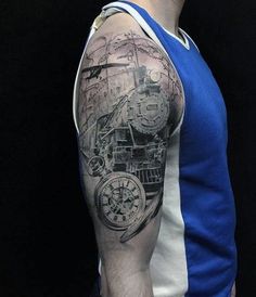 a man's arm with a train tattoo on it