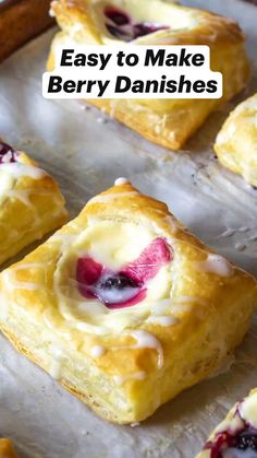 homemade berry danishes on baking sheet with text overlay that reads easy to make berry danishes