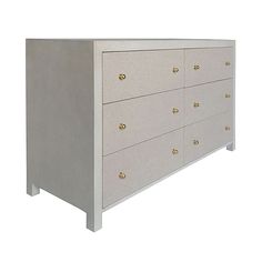 a white dresser with gold knobs on the top and bottom drawers, against a white background