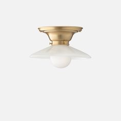 a brass ceiling light with a white glass shade on the top and one light in the middle