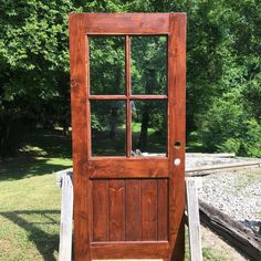 an old wooden door with glass panes