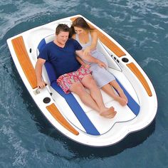 a man and woman are sitting on a small boat