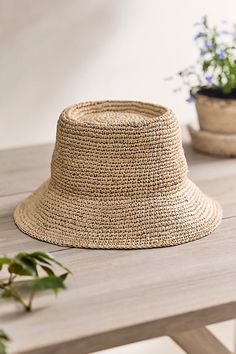 This hand-crocheted raffia bucket hat with a telescope crown adds a twist to a classic sunny day accessory. | Crocheted Raffia Bucket Hat in Beige at Terrain Casual Straw Bucket Sun Hat, Spring Straw Bucket Hat, Woven Summer Bucket Hat, Adjustable Bucket Straw Hat For Beach, Spring Bucket Straw Hat, Summer Bucket Hat In Straw, Vacation Bucket Hat With Woven Detail, Woven Bucket Hats For Summer, Woven Bucket Hat For Vacation