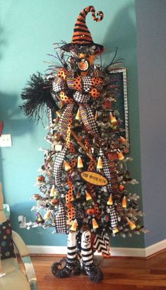 a decorated christmas tree in the corner of a room