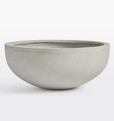 a white bowl sitting on top of a table