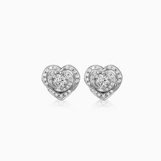 ✥ Indulge in the timeless beauty of these Round Cut Halo Moissanite Diamond Stud Earrings for Women. The exquisite design features a round cut Moissanite diamond surrounded by a halo of sparkling diamonds, creating a stunning display of brilliance. Crafted with precision and attention to detail, these earrings exude elegance and sophistication. Whether it's a formal event or a casual outing, these earrings are the perfect accessory to elevate any look. With their versatile design, they effortles Timeless Cubic Zirconia Bridal Earrings For Anniversary, Diamond White Halo Design Earrings For Anniversary, Elegant Heart Cut Diamond Earrings With Vvs Clarity, Heart Cut Diamond Earrings With Halo Design, Anniversary Halo Design Lab Grown Diamond Earrings, Timeless Cubic Zirconia Cluster Earrings For Anniversary, Diamond White Heart Cut Diamond Earrings For Formal Occasions, Formal Heart Cut Diamond White Earrings, Heart Cut Diamond White Earrings For Formal Occasions