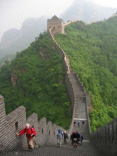 people walking up the great wall of china