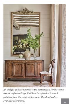 a living room with a large mirror on the wall