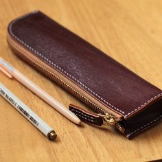 The case is for pencils and/or make up gear! The Vegetable Tanned Leather case can hold up to your pencils or other something you want to keep hold. It is very secure, but easy to open. The pencil case is made from vegetable tanned cowhide leather. The natural color of the leather may Brown Pouch Pencil Case For Personal Use, Brown Pencil Case For Everyday Use, Brown Zipper Pouch Pencil Case For Personal Use, Brown Pencil Case Pouch With Pen Slots, Brown Pencil-shaped Case For Personal Use, Brown Pencil Case With Pen Slots, Brown Zipper Pouch Pencil Case, Everyday Brown Pencil Case With Pen Holders, Brown Rectangular Pencil Case With Pen Holders