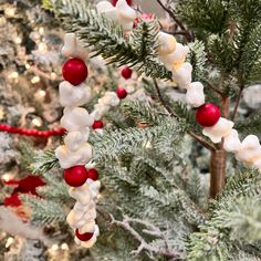 a christmas tree decorated with white and red ornaments