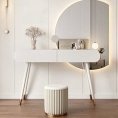 a white dressing table with a mirror and stool in front of it on a wooden floor