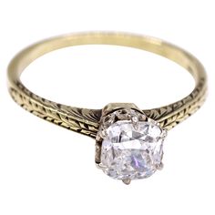 This charming engagement ring from ca 1936 features a bright white and lively cushion diamond weighing 1.1o carats, accompanied by a report from the GIA grading it G VS1. Secured by 6 eagle-claw prongs on a white ornate gallery and a hand engraved yellow gold shank. Ring size 6.75, can be sized Formal Single Diamond Cushion Cut Ring, Heirloom Cushion Cut Diamond Ring With Single Cut Diamonds, White Cushion Cut Diamond Ring, Heirloom Cushion Cut Diamond Ring, Antique Cushion Cut Ring With Single Cut Diamonds, Antique Cushion Cut Single Diamond Rings, Antique Cushion Cut Rings With Single Cut Diamonds, Formal Cushion Cut Diamond Ring With Single Diamond, Heirloom Cushion Cut Diamond Ring With Center Stone