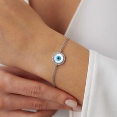 A lovely evil eye design in which the evil eye is accompanied by hand-selected natural diamonds. The double-chain design ensures the safety of the piece so that you can enjoy this piece for many years to come.★ Bracelet Features • Gold Kt: 14K/18K Solid Gold (According to your preference)• Available Gold Colors: Yellow Gold, White Gold, Rose Gold• Total Diamond weight: 0.20 carat• Diamond color: G color VS2/SI1 clarity• We only work with real natural diamonds• We include a signed certificate wit Luxury Diamond Jewelry With Evil Eye Detail, Evil Eye Diamond Jewelry As Gift, Diamond Evil Eye Jewelry In Yellow Gold, Evil Eye Diamond Jewelry Gift, Diamond Evil Eye Jewelry Gift, Yellow Gold Diamond Evil Eye Jewelry, Yellow Gold Diamond Jewelry With Evil Eye, Adjustable Jewelry With Diamond Eyes And Cubic Zirconia, Elegant Evil Eye Bracelet With Diamonds As Gift