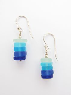 These earrings are made with stacked graduating blue color glass. Each handmade earrings is 1 3/8 inch in length, including the ear wire. All Sterling Silver is components, wire, round beads, headpin and earwires. The pendants are made with recycled glass and put through a man-made process that simulates the effect of many years of erosion by Mother Nature and the Sea. More earrings: https://www.etsy.com/listing/203878280/handmade-cultured-sea-glass-earrings?ref=shop_home_active_1&frs=1 Also Adjustable Blue Jewelry Made Of Recycled Glass, Adjustable Blue Jewelry With Recycled Glass, Adjustable Blue Recycled Glass Jewelry, Blue Recycled Glass Dangle Earrings, Nickel-free Blue Recycled Glass Earrings, Blue Recycled Glass Nickel-free Earrings, Blue Nickel-free Recycled Glass Earrings, Blue Wire-wrapped Glass Earrings, Blue Glass Wire Wrapped Earrings