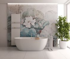 a white bath tub sitting next to a potted plant