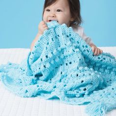 Keep babies curious with this sweet blanket's bobbles and lace, crocheted in Bernat Baby Sport. One Skein Crochet, Ripple Stitch, Blue Baby Blanket, Crochet Afghan Patterns Free, Crocheted Blanket, Baby Afghan Crochet, Crochet Bebe, Manta Crochet, Afghan Patterns