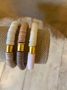 Set of 3 ~ High Quality Heishi Bead stretch bracelets! This 6mm bracelets features a gold bar, can do a solid color or color block with two colors! Fun and Flirty, Boho/ chic vibes. Can be stacked for a on trend fun look! Mix and match colors! can order a 6.5 , 7 or 7.5 inch bracelet~ let me know in the notes your size! Etsy only gives the option to choose 2 colors - you CAN choose different color combinations for each bracelet Please tell me in the notes section your color combinations for brac Gold Stacked Heishi Beads Stretch Bracelet, Adjustable Stacked Heishi Beads Stretch Bracelet, Casual Gold Heishi Beads Stretch Bracelet, Adjustable Stacked Beaded Bracelets For Everyday, Everyday Stackable Heishi Beads Stretch Bracelet, Adjustable Stackable Jewelry With Heishi Beads, Bracelet Business, Vinyl Disc, Heishi Bracelet