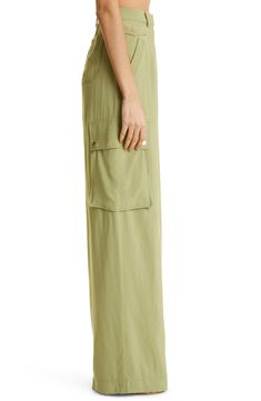 Cargo-style pockets lend practical appeal to high-waist pants kept free-flowing with a wide-leg silhouette. 34" inseam; 26" leg opening; 14 1/2" front rise; 18" back rise (size 8) 83% rayon, 17% nylon Dry clean Imported Spring Utility Wide Leg Pants, Spring Green Wide Leg Cargo Pants, Spring Wide-leg Parachute Pants With Pockets, Spring Utility Full Length Parachute Pants, Versatile Summer Pants With Patch Pockets, Green Wide Leg Pants With Cargo Pockets For Spring, Green Cargo Wide Leg Pants For Spring, Spring Parachute Pants With Patch Pockets, Spring Wide Leg Utility Pants