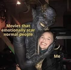 a woman hugging a statue with the caption movies that emotionally scar normal people me