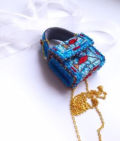 "Little handbag for coins or face mask. Made with the inspiration of glass wall art.  All material are used to show \"glass\" effect.  *Dimensions 5,5x7x2 cm *Chain 1,35 m *Handbag closes with magnets * Inside is  made from wild silk No returns Color on photo and life  can change a bit, due to monitor specification Do not accept orders from Canada, Australia and Germany (from 0.1.07.2022).  Shipping from Latvia to Europe usually takes 3-10 days, USA 20-30 days.  Thank you for your visit!" Handmade Bucket Bag For Gift, Small Handmade Bags For Daily Use, Blue Pouch As Gift Bag, Small Mobile Phone Bag As Gift, Blue Shoulder Bag Mobile Phone Bag For Gift, Blue Pouch For Gift, Blue Shoulder Bag For Mobile Phone As Gift, Square Portable Pouch As Gift, Handmade Pouch Bags For Personal Use