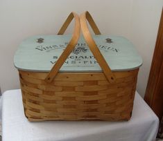 a wooden basket sitting on top of a table