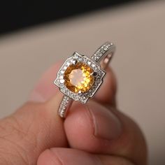 This is a gorgeous handmade creation. Its beauty is its simplicity & Elegance. The 7*7mm round cut natural citrine is crafted in solid sterling silver and with rhodium plated. It is available to customized, if you have any mind, just let me know, we will discuss with it. All item is sent in a beautiful gift box You can realize more lovely stuff clicking the link https://www.etsy.com/shop/knightjewelry?refshopsection_shophome_leftnav Please leave the correct address and you PHONE NUMBER for d Yellow Citrine Ring, Gemstone Ring Silver, Cushion Cut Ring, Cushion Ring, Yellow Citrine, Citrine Ring, Natural Citrine, November Birthstone, Proposal Ring