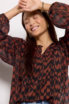 Refresh your fall wardrobe with this stylish printed blouse by EVEREVE. Finished in semi-sheer fabric, this flowy silhouette features long puff sleeves, ruffled seams, and a split neckline with a covered button. Take it from day to night with jeans or vegan leather pants. Note: This top is unlined. Cami not included. Fall Blouse With Pleated Ruffle Sleeves, Long Sleeve Viscose Blouse With Ruffles, Pleated Ruffle Sleeve Blouse For Fall, Flowy Lantern Sleeve Blouse With Ruffles, Fall Flowy Blouse With Bishop Sleeves, Long Sleeve Viscose Blouse With Gathered Sleeves, Fall Viscose Ruffle Top, Fall Ruffle Viscose Tops, Flowy Blouse With Gathered Sleeves For Fall