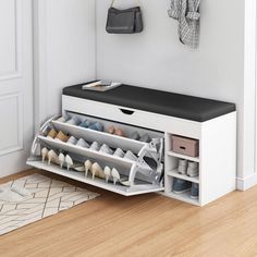 a white shelf with several pairs of shoes on it in front of a wall mounted coat rack