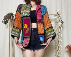 Hey there, beautiful soul! Embrace boho chic with our Handmade Boho Granny Square Crochet Cardigan! This multicolor patchwork floral jacket blends vibrant hues in a short hippie style. Lovingly crafted by artisans, it's the perfect cozy yet trendy knitwear addition to any wardrobe. Elevate your look with unique, handmade charm! ATTENTION Size: Small / Medium / Large Competible Welcome to our exclusive sample product discount! Presenting a unique and exquisite item crafted with love and meticulou Bohemian Multicolor Outerwear For Spring, Vintage Patchwork Sweater For Spring, Spring Vintage Patchwork Sweater, Bohemian Multicolor Outerwear For Fall, Bohemian Fall Festival Sweater, Multicolor Bohemian Outerwear For Fall, Colorful Bohemian Outerwear For Spring, Spring Vintage Patchwork Cardigan, One Size Bohemian Sweater