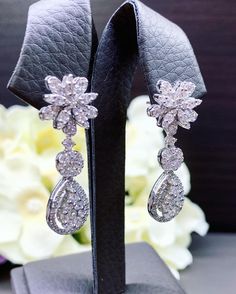 HANDCRAFTED TO PERFECTION! SPECIAL AND LOVELY FLORAL DESIGN, ILLUSION SETTING (APPEARS TO BE LIKE A 0.5 CARAT BRILLIANT PEAR Diamonds). With over 128 pieces of UNTREATED AND GENUINE F/VS QUALITY SPARKLING DIAMONDS! Perfect for every event! SET IN 18K SOLID WHITE GOLD HANDCRAFTED, DANGLING EARRINGS! SUGGESTED RETAIL VALUE: $8,800 DIAMONDS: 128 ROUND BRILLIANT, FULL CUT with excellent firing diamonds, weighting at 2.16 carats. ALL NATURAL, UNTREATED DIAMONDS. ALL DIAMONDS HAVE NO VISIBLE INCLUSION Formal Diamond White Chandelier Earrings With Brilliant Cut, Elegant White Gold Pear-shaped Chandelier Earrings, Dazzling Brilliant Cut Chandelier Earrings For Formal Occasions, Dazzling Brilliant Cut Chandelier Earrings For Formal Events, Dazzling Diamond White Brilliant Cut Chandelier Earrings, Dazzling Diamond White Chandelier Earrings With Brilliant Cut, Dazzling White Diamond-accent Chandelier Earrings, Formal Chandelier Earrings With Brilliant Cut Cubic Zirconia, Brilliant Cut Pear-shaped Earrings For Party