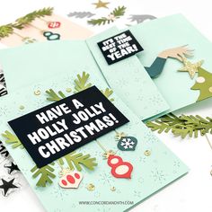 some christmas cards are laying on top of each other, with the words have a holly jolly christmas