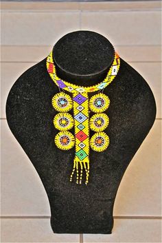 African Zulu Beaded Necklace -  CHOKER - Yellow Rosettes by Hadeda on Etsy Yellow Beaded Choker For Festivals, Yellow Choker Necklace For Festivals, Festival Choker With Large Beads, Yellow Round Beads Choker For Festivals, Yellow Beaded Choker Necklace For Festivals, Yellow Choker With Round Beads For Festivals, Yellow Festival Choker With Round Beads, Unique Yellow Choker Necklace, Adjustable Yellow Round Beads Choker