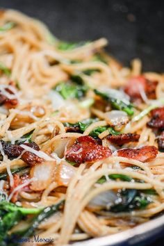 pasta with bacon and spinach in a bowl