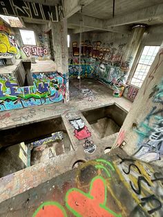 an abandoned building with graffiti all over the walls