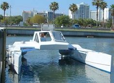 there is a small boat in the middle of the water with it's front end sticking out