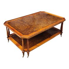 an antique coffee table with two shelves on each side and one shelf below it that is turned upside down