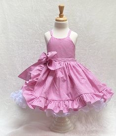 "Pink Gingham babygirl tulle dress Welcome to my shop.  Get ready to make a statement with this adorable Pink Gingham babygirl dress. This fun, pretty pink gingham ruffle dress is the perfect dress for your little one's birthday party, Halloween costume, pageant dress, or any special occasion.  This lovely dress is handmade from start to finish, by me in my studio.  There is no doubt your little one will be so excited to wear this pink gingham barbie costume.  *The bodice and skirt are fully lin Gingham Barbie, Pink Birthday Dress, Baby Tulle Dress, Pageant Costumes, First Birthday Dress, First Birthday Dresses, Barbie Costume, Wonder Woman Costume, Toddler Costumes