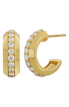 A center row of prong-set diamonds brings stunning sparkle to polished hoop earrings handcrafted from 18-karat yellow gold. 5/8" hoop diameter, 1/4" width Post back Total diamond weight: 0.75ct. Color: G Clarity: VS Handcrafted 18k gold/diamond Imported >Diamond Guide Timeless Gold Huggie Earrings With Brilliant Cut, Luxury Yellow Gold Diamond Earrings With Vvs Clarity, Luxury Diamond Huggie Earrings For Formal Occasions, Luxury Vvs Clarity Yellow Gold Diamond Earrings, Classic Hoop Huggie Earrings With Pave Setting, Classic Huggie Earrings With Baguette Cut Prong Setting, Gold Baguette Cut Diamond Earrings With Accents, Yellow Gold Diamond Earrings With Baguette Cut, Small Hoop Diamond Earrings In Yellow Gold