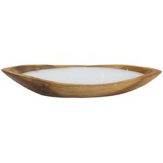 a wooden bowl with a white candle inside