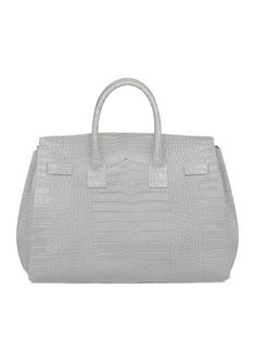 DESIGN
The new Gigi handbag encapsulates Teddy Blake's modern-classic appeal. Made in Italy from croco embossed calf skin the semi structured silhouette is reworked to fit an on-the-go lifestyle. The detachable strap allows it to be styled over the shoulder and the roomy interior can fit all your daily essentials &more.
DESCRIPTION
Made In ItalyCroco embossed leather with white stitchingReal suede interiorGold toned hardware
DETAILS
Media10.6"h x 5.7"w x 13.4"lHandle drop length: 3.4"17" to 23" Teddy Blake, How To Make Handbags, Daily Essentials, Modern Classic, Embossed Leather, Italian Leather, Emboss, Leather Handmade, Leather Handbags