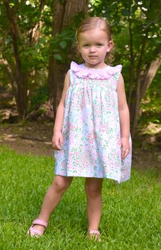 Meet Isla- Your little one's go-to floral dress for the warmer months. She's comfy, soft, and features the most gorgeous pink ruffled collar with smocking details. 100% Cotton, lined, with button back closure. * Matching Bubble Available. Flutter Sleeve Smocked Dress With Ruffles For Garden Party, Spring Pink Smocked Dress With Flutter Sleeve, Pink Smocked Bodice Dress With Ruffle Sleeves, Pink Dresses With Smocked Bodice And Ruffle Sleeves, Spring Dress With Smocked Bodice For Playdate, Pink Smocked Dress With Ruffle Sleeves, Cute Smocked Dress For Spring Garden Party, Cute Dresses With Ruffle Hem And Ruffled Collar, Pink Smocked Dress With Ruffle Hem And Flutter Sleeve