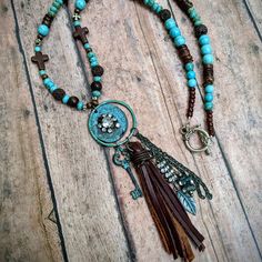 Nwt From My Craft Boutique Handcrafted Beaded Western Charm And Brown Suede Fringe Tassel Toggle Clasp Length Is 23 Inches Long Charms Add Additional 3 1/2 Inches Bohemian Brown Necklace With Dangling Beads, Rustic Blue Beaded Necklaces, Rustic Blue Beaded Necklace, Stretch Beaded Bracelets Diy, Craft Boutique, Western Necklace, Western Necklaces, Boho Cowgirl, Cowgirl Jewelry