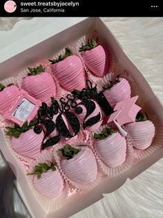 a pink box filled with chocolate covered strawberries and the number twenty five on it