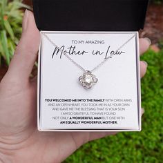 Surprise your mother in law with this gorgeous gift today! The beautiful Love Knot is crafted with brilliant 14k white gold over stainless steel, and swings from an adjustable cable chain, fastened securely with a lobster clasp. The center cubic zirconia crystal measures 6mm in diameter, and is surrounded with smaller cubic zirconia, showcasing added sparkle and shine to this gorgeous gift. You must see it for yourself! Specifications: • 14k white gold over stainless steel • 6mm round cut cubic Elegant Stainless Steel Necklace For Father's Day, Mother's Day Adjustable Chain Jewelry For Anniversary Gift, Mother's Day Jewelry With Adjustable Chain For Anniversary, Mother's Day Jewelry Gift With Adjustable Chain, Stainless Steel Jewelry For Anniversary, Mother's Day Gift, Adjustable Chain Jewelry For Mother's Day Anniversary Gift, Meaningful White Jewelry For Mother's Day, Elegant Hallmarked Jewelry For Father's Day, Meaningful White Jewelry For Anniversary