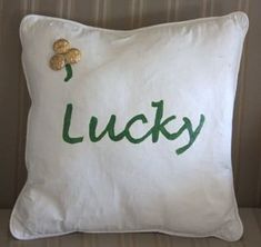 a pillow with the word lucky written on it