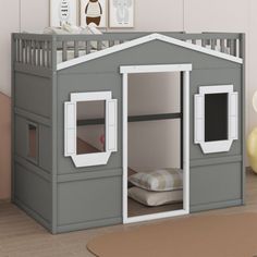 a child's bedroom with a loft bed and gray walls